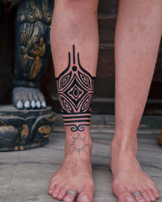 Big Tribal Geometric Patterns Sun Symbol on Women Leg Tattoo by @neuro.tattoo
