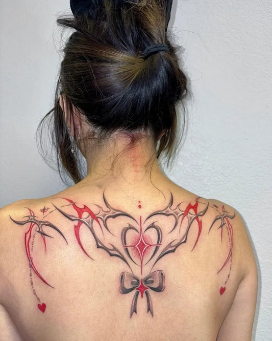 Big Tribal Heart Wings on Women Back Tattoo by @marcie.ink
