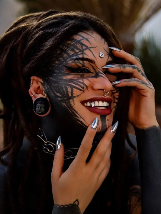 Big Tribal Lines on Women Face Tattoo by @raven_77