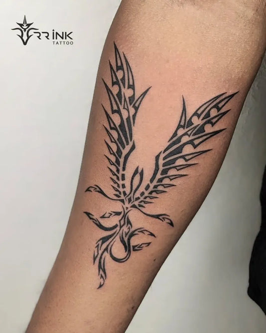 Big Tribal Phoenix on Men Arm Tattoo by @rr_ink_tattoo_cherpulassery