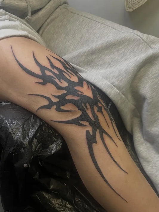 Big Tribal Spiked Branches on Women Thigh Tattoo by @kontrastschwarz