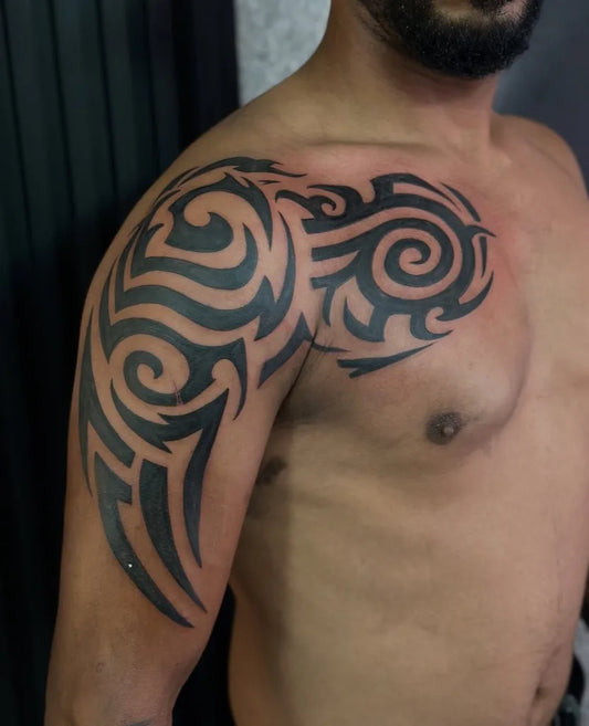 Big Tribal Spiral Tribal Patterns on Men Shoulder Tattoo by @wasem.tattoo