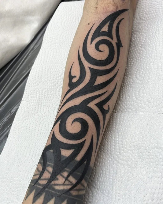 Big Tribal Spirals and Flames on Men Arm Tattoo by @bbok2gonzo