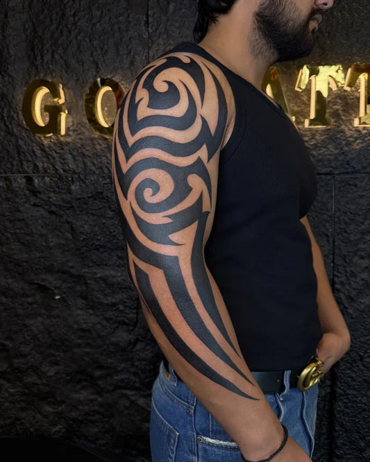 Big Tribal Swirling Black Patterns on Men Arm Tattoo by @luv_luvkush