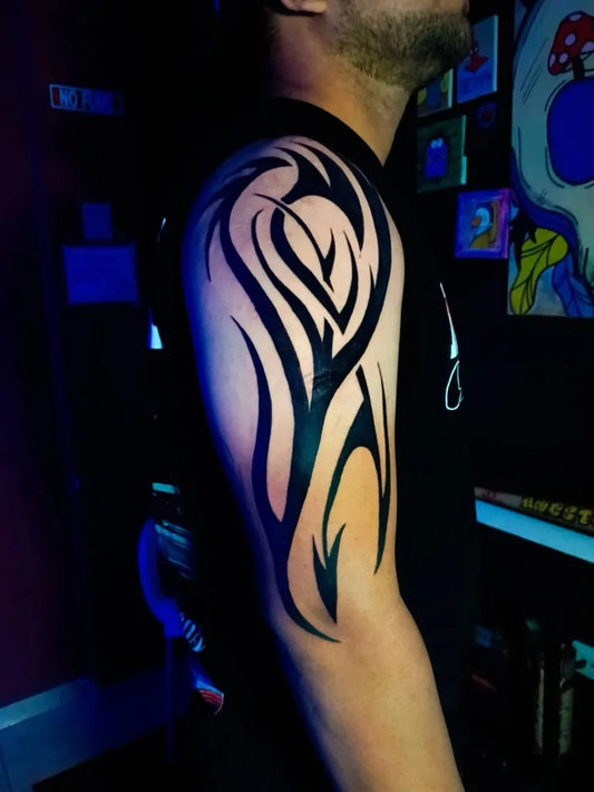 Big Tribal Tribal Flame Design on Men Arm Tattoo by @adry_ink