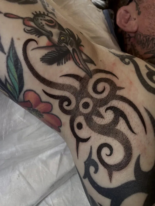 Big Tribal Tribal designs skull feathers on Men Arm Tattoo by @jonjamescase