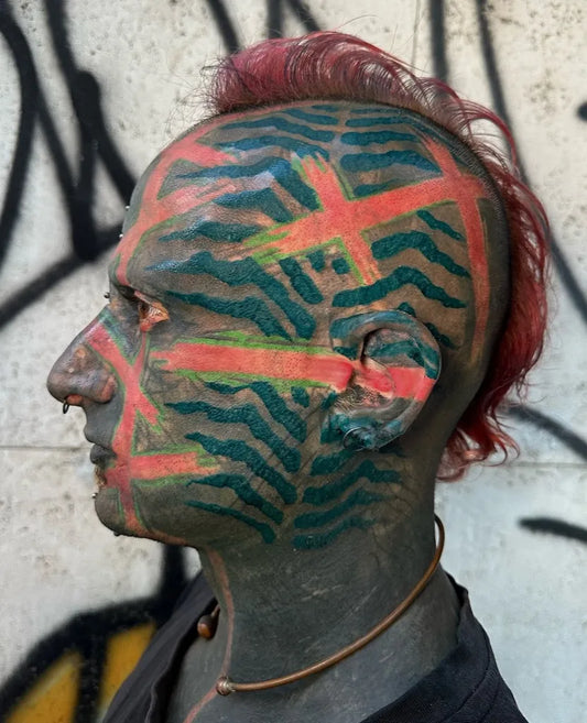 Big Tribal Zebra Stripes on Men Face Tattoo by @giacomofanzon_tattooer