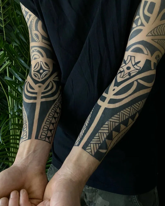Big Tribal geometric patterns lines triangles on Men Arms Tattoo by @scarpellini_tribaltattoo