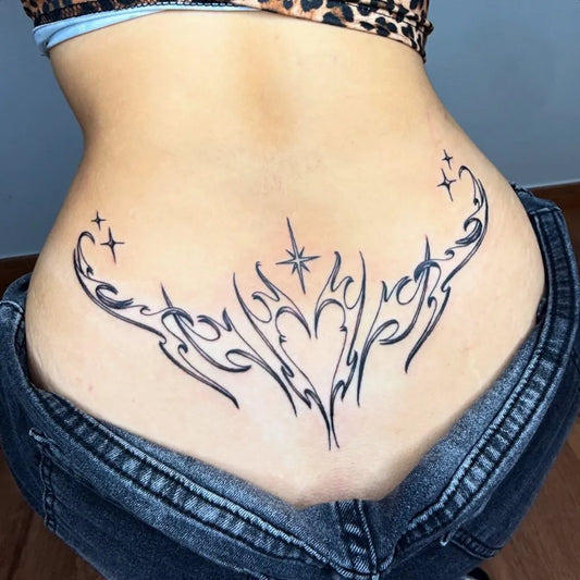 Big Tribal heart stars on Women back Tattoo by @suavetattoo