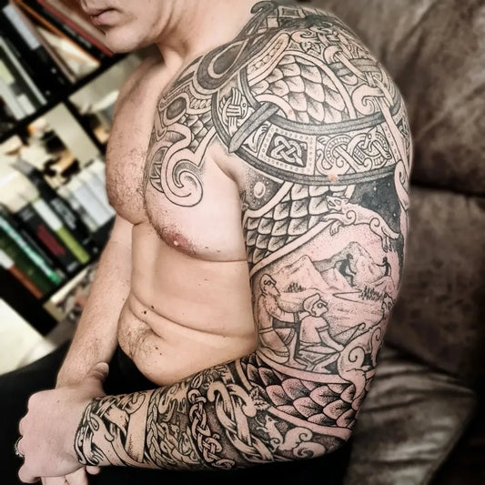 Big Viking Norse knots and dragon scales on Men Arm Tattoo by @dyrs_hjarta_art