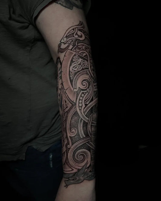 Big Viking dragon knots spirals on Men Arm Tattoo by @zouzou_tattoo_anansi