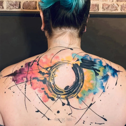 Big Watercolor Abstract Circle and Splashes on Women Back Tattoo by @artofmandyfrank