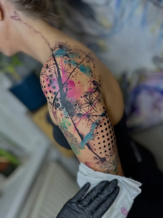 Big Watercolor Abstract Splatter and Dots on Women Shoulder Tattoo by @any_tattoo