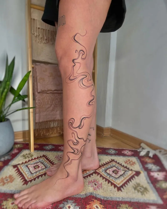 Big Watercolor Abstract Waves on Women Leg Tattoo by @lieli.soul