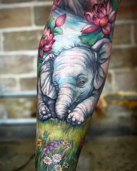 Big Watercolor Baby Elephant with Lotus Flowers Tattoo on Women Leg by @jintattoo
