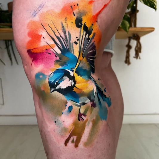 Big Watercolor Bluebird on Women Thigh Tattoo by @fluidtattoomachine