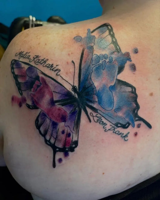 Big Watercolor Butterfly with footprints and names on Women Shoulder Tattoo by @paultrenz