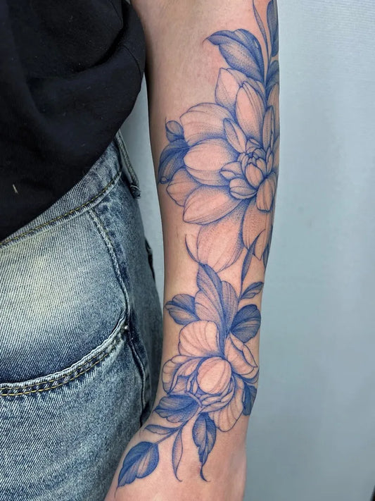 Big Watercolor Dahlia Branch and Leaves on Women Arm Flower Tattoo by @micagavotto.tattoo