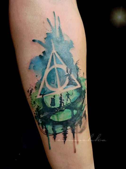 Big Watercolor Deathly Hallows Symbol with Figures on Women Arm Tattoo by @ostgut_tattoo