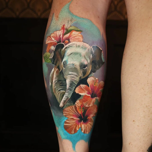 Big Watercolor Elephant and Hibiscus Tattoo on Women Leg by @samjordantattoo