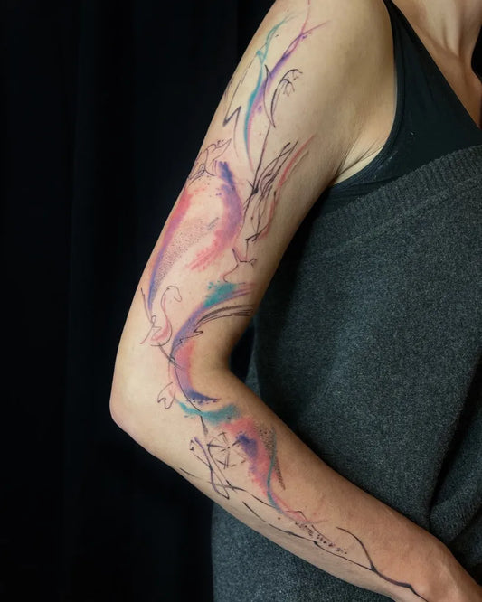 Big Watercolor Flowers Birds on Women Arm Tattoo by @michaela_tattoo