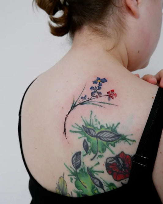 Big Watercolor Flowers and Leaves on Women Back Tattoo by @js_hontattoo