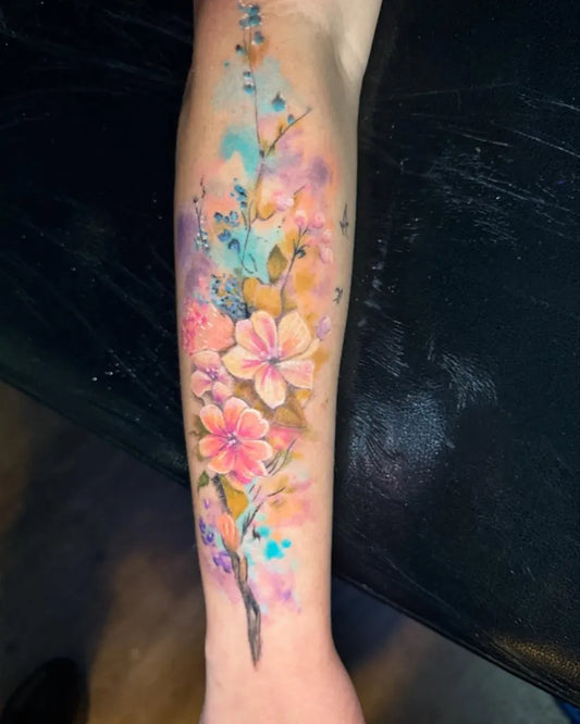 Big Watercolor Flowers and Vines on Women Arm Tattoo by @mikemadisontattoo