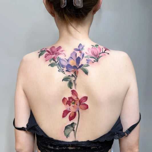 Big Watercolor Flowers on Women Back Tattoo by @yuxin_tsai