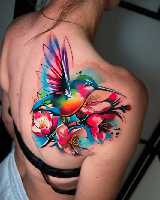 Big Watercolor Hummingbird and Cherry Blossoms on Women Shoulder Tattoo by @cloto.tattoos