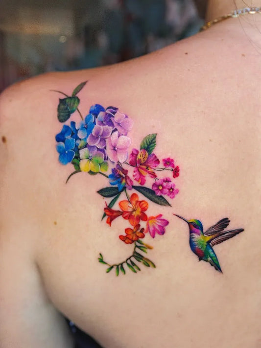 Big Watercolor Hummingbird and Hibiscus Flowers on Women Shoulder Flower Tattoo by @ssuncolor