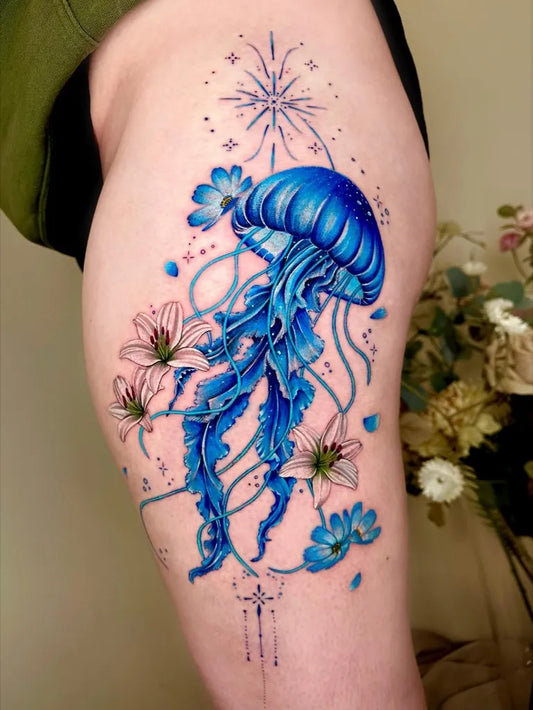 Big Watercolor Jellyfish and Flowers Tattoo on Women Thigh by @claire_tattoos_