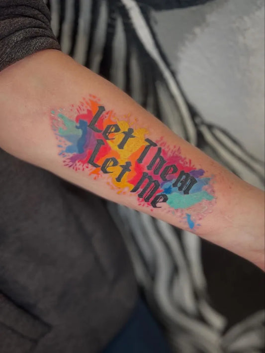 Big Watercolor Let Them Text on Women Arm Tattoo by @wreckless_ink_