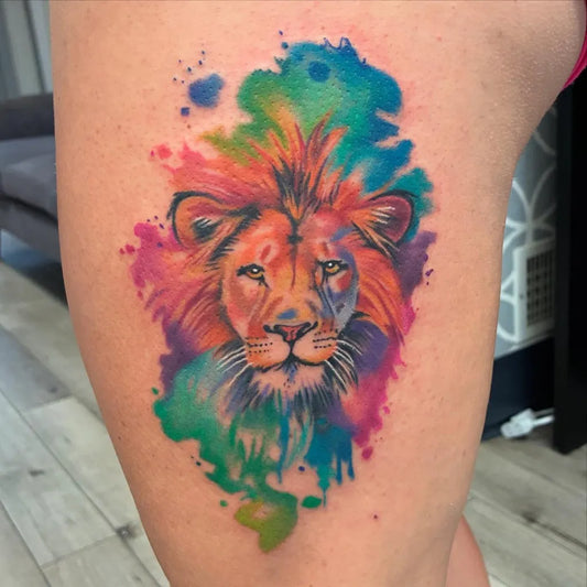 Big Watercolor Lion on Women Thigh Tattoo by @tylerbudimlija