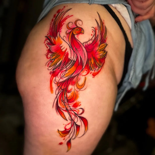 Big Watercolor Phoenix on Women Hip Tattoo by @imperialarttattoo