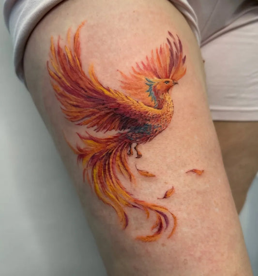 Big Watercolor Phoenix on Women Thigh Tattoo by @olha.steblii