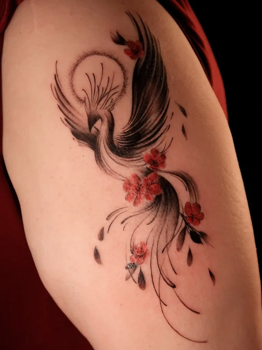 Big Watercolor Phoenix with Flowers on Women Shoulder Tattoo by @silvieetattoo