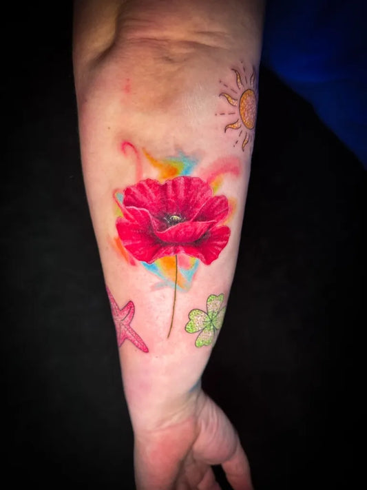 Big Watercolor Poppy Flower with Sun and Starfish on Women Arm Tattoo by @mayink_official