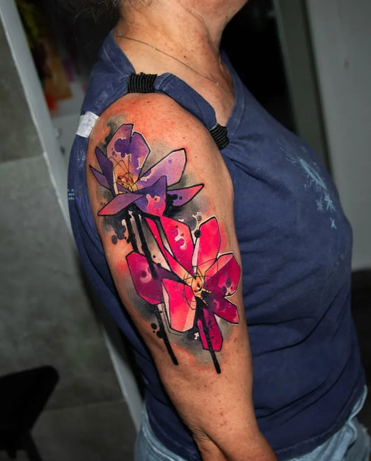 Big Watercolor Purple and Pink Orchids on Women Arm Tattoo by @unclpaulknows