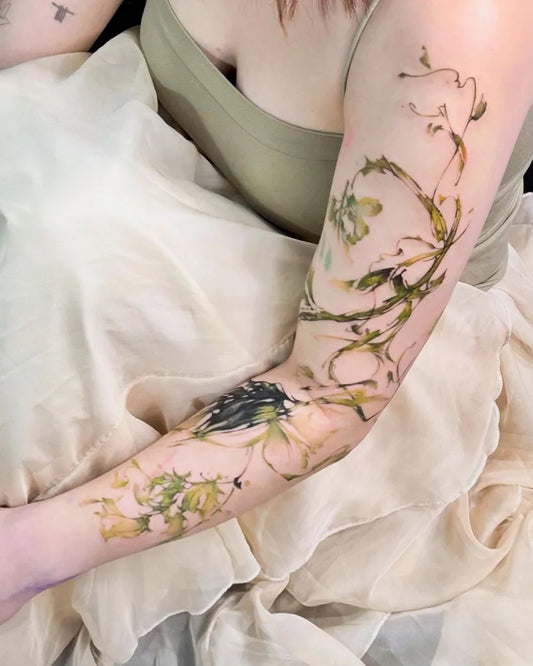 Big Watercolor Vines and Leaves on Women Arm Tattoo by @hongcha_tt