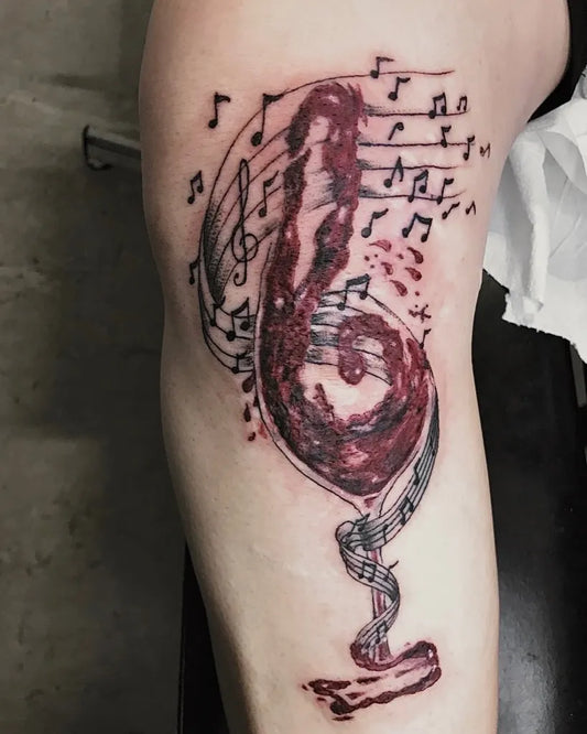 Big Watercolor Wine Glass Music Tattoo on Women Arm by @livingcolorstattoo