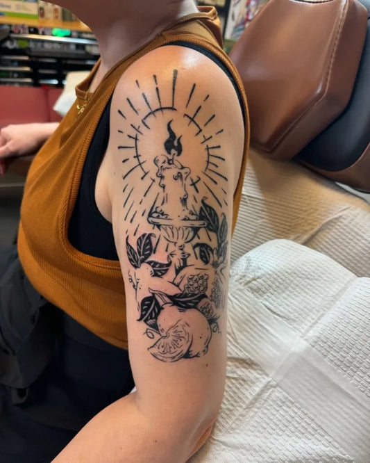 Big Woodcut Candle with Rays and Flowers Tattoo on Women Shoulder by @nami.flowers