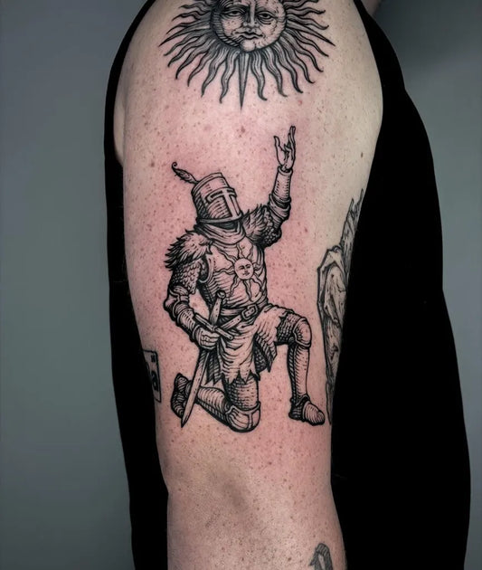 Big Woodcut Kneeling Knight with Sun Tattoo on Men Shoulder by @vox.maeot