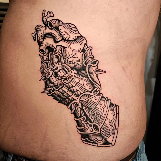 Big Woodcut Mechanical Heart Hand Tattoo on Men Torso by @404.tattoos