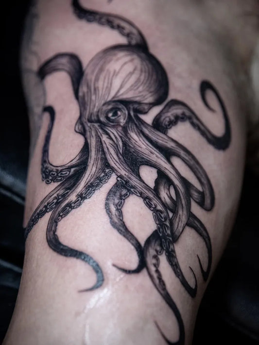 Big Woodcut Octopus Tattoo on Men Thigh by @inkedbykristinamurphy