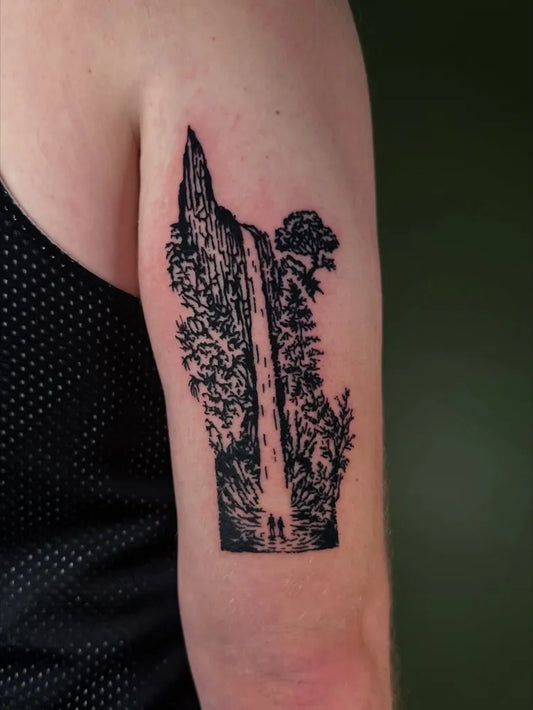 Big Woodcut Waterfall Mountain Forest Tattoo on Women Upper Arm by @tapiotats