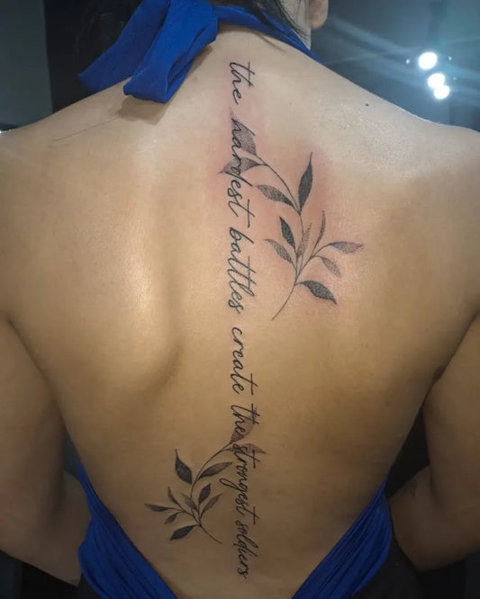 Big Wordy Quote with Leaves on Women Spine Tattoo by @whelantattoo