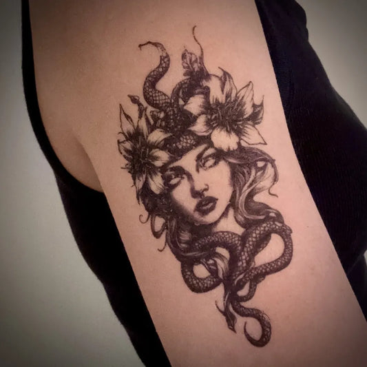 black and grey Medusa flower temporary tattoo on women upper arm