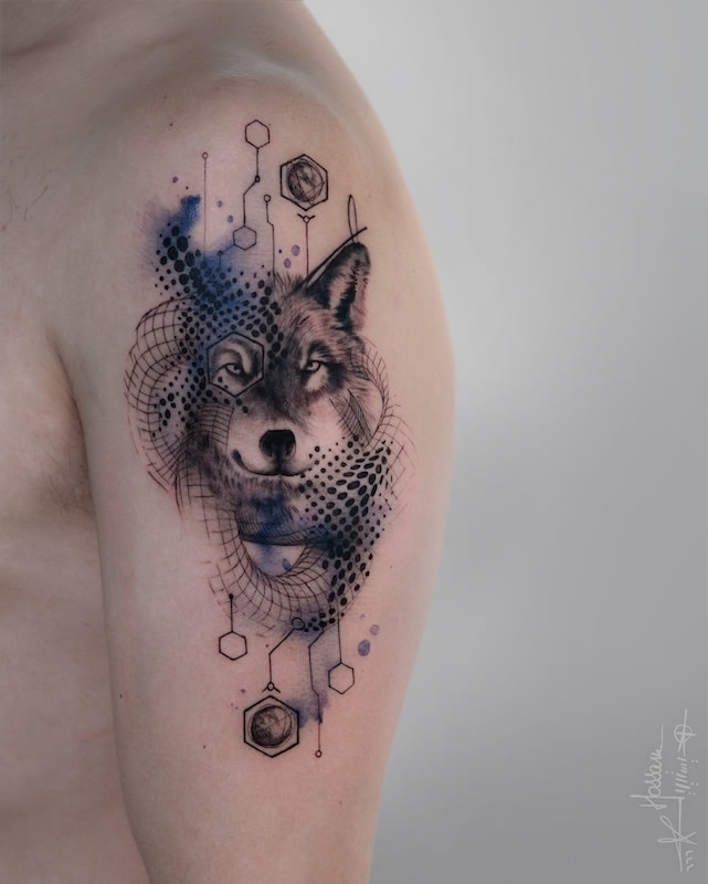 watercolor geometric abstract fox tattoo on man upper arm