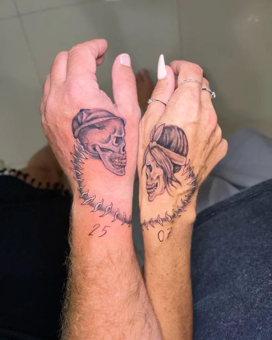 Matching Black and Grey Skeleton with Bandana and Barbed Wire Tattoo on Women Hand by @cryptoinktattoo