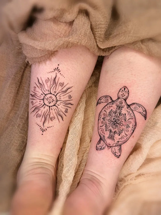 Matching Blackwork Turtle and Sun Tattoo on Women Legs by @anais.art.ink